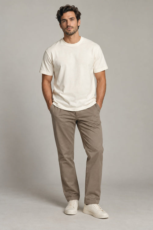 Male model wearing Northvale essential crewneck t-shirt in ivory