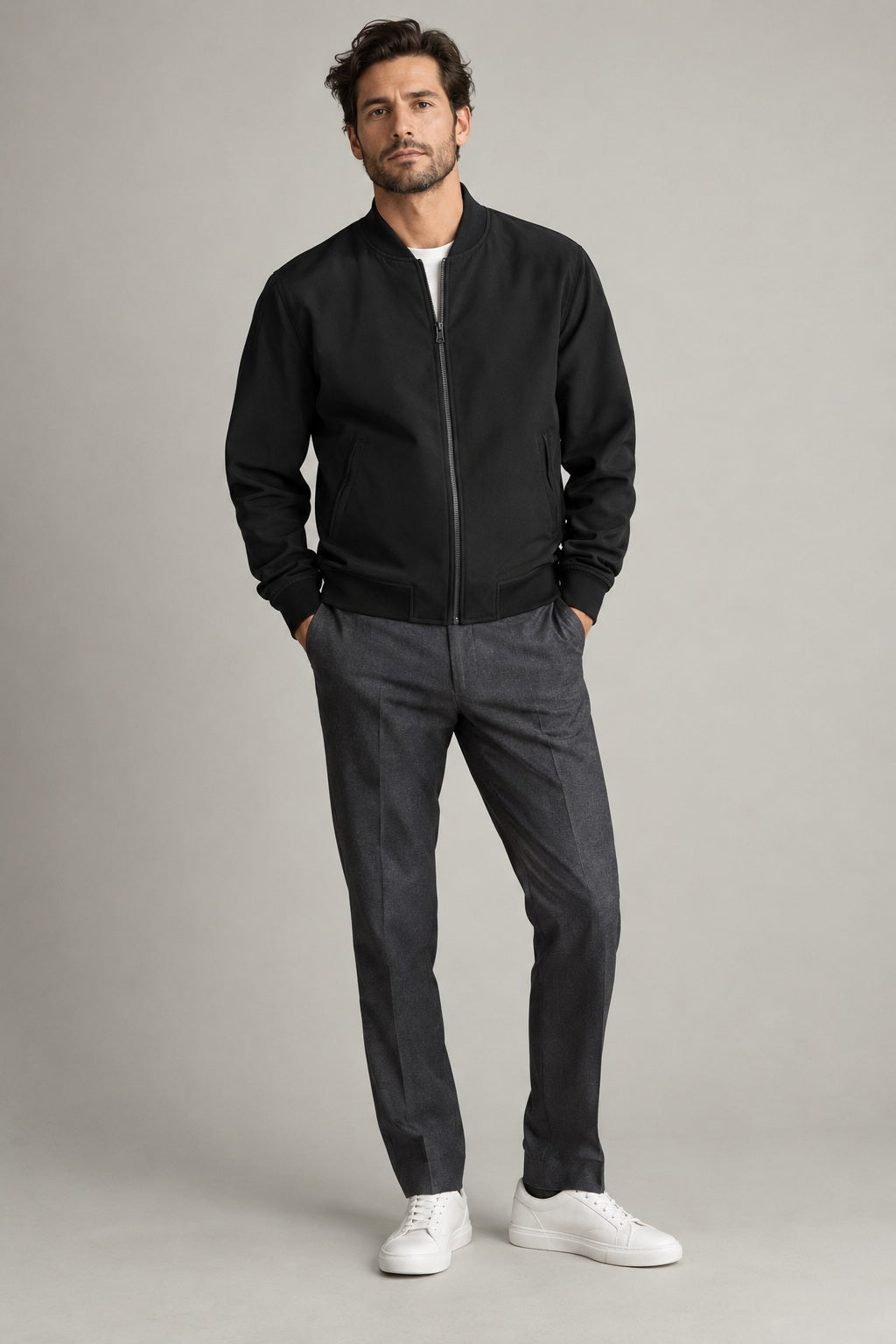 Male model wearing Northvale modern bomber jacket in black