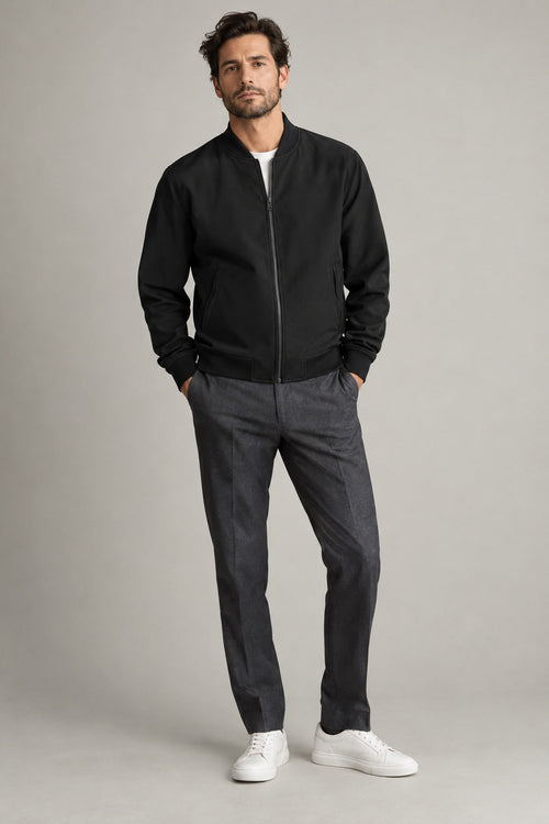 Male model wearing Northvale modern bomber jacket in black